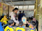 Polres Inhil dan HMI Tembilahan Gelar Green Policing di SD Marginal Tasik Pilang, Salurkan Bantuan Pendidikan dan Bibit Pohon